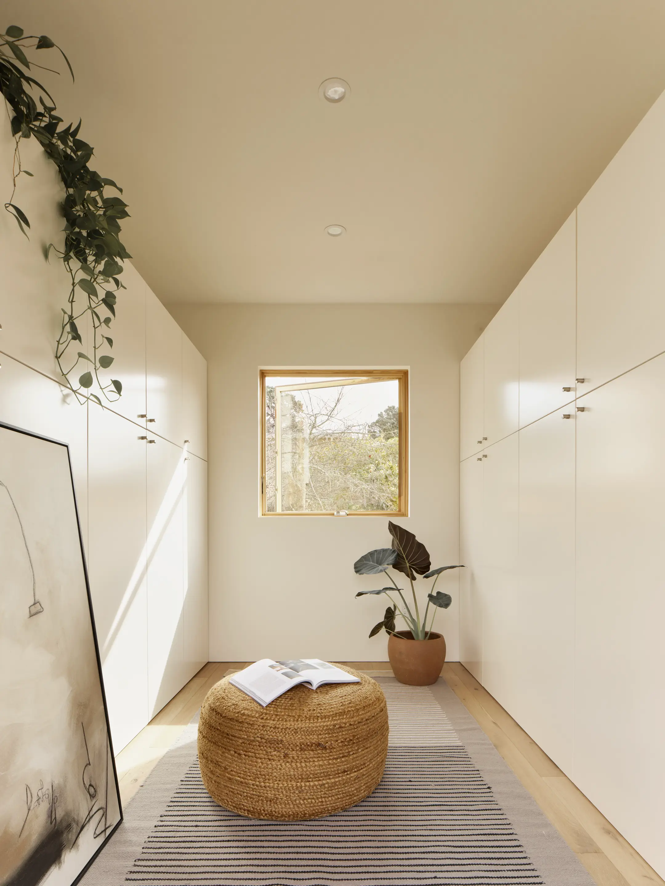 Intelligent integrated storage solutions in Type Five ADU with space-efficient closets and cabinets for maximized organization